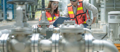 Two engineers inspecting industrial facility