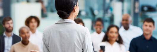 Businesswoman giving a presentation in the office boardroom.