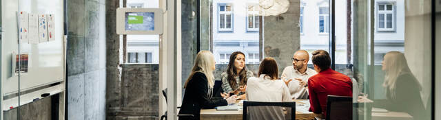 People having a meeting in a conference room