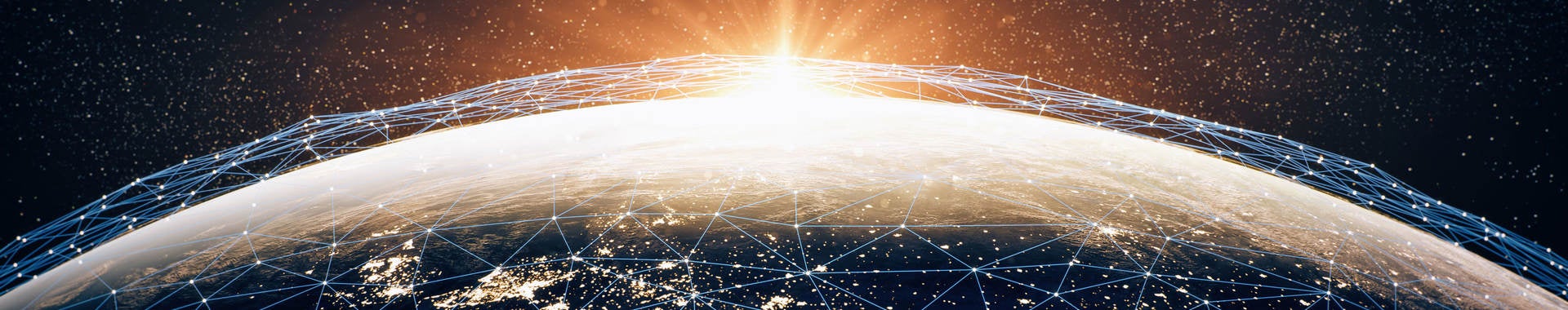 A series of interconnecting points of light across the earth, representing cybersecurity. 