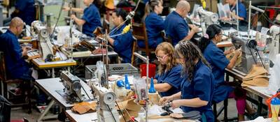 Manual workers working at a factory.