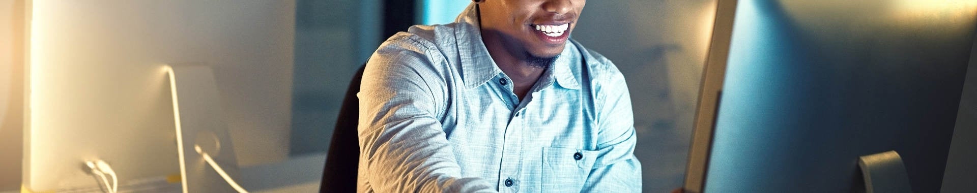 Shot of a young businessman working late in an office