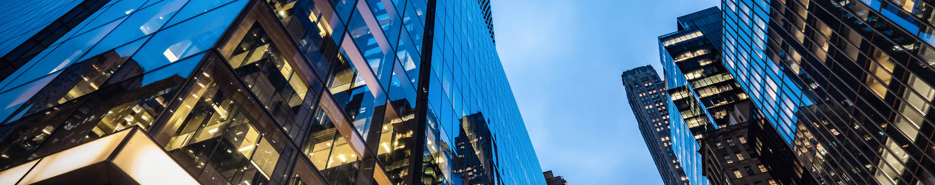  Skyscrapers at dusk, with lit offices