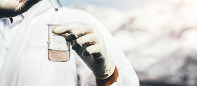 Close-up of person testing water sample.