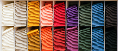 Colorful clothes on a retail shelf