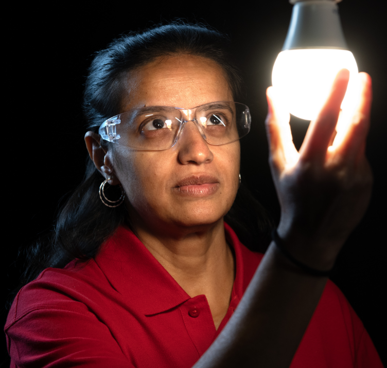 Person looking at a lightbulb