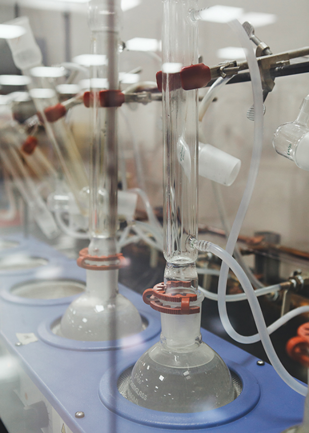 Closeup of water being distilled in beakers